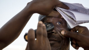 A man has his eyes checked for trachoma in Ghana.