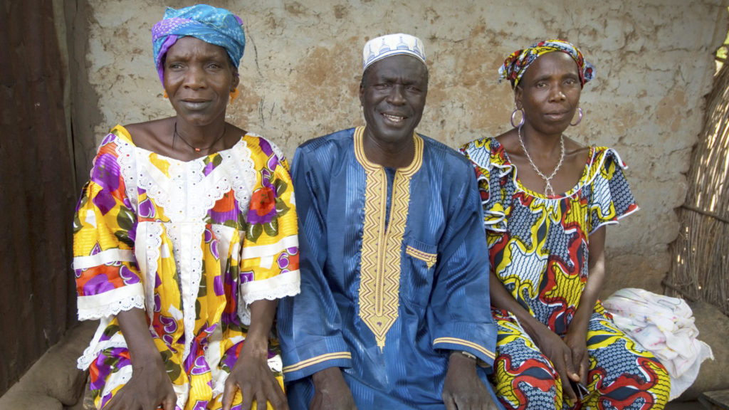 Juledh outside her home with her brother, Jadeh Ceesay and sister Mariam.