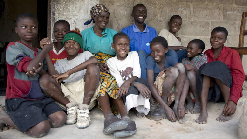 A group of smiling residents from the town of Mufulira in Zambia.