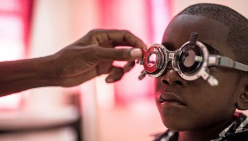 A boy having his eyes tested.