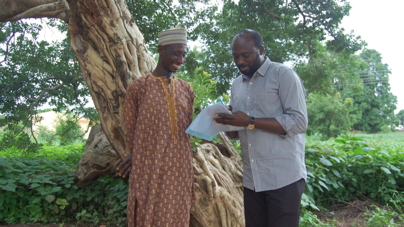 A man being counselled by a health worker.