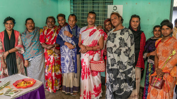 A large group of transgender women pose for a photo.
